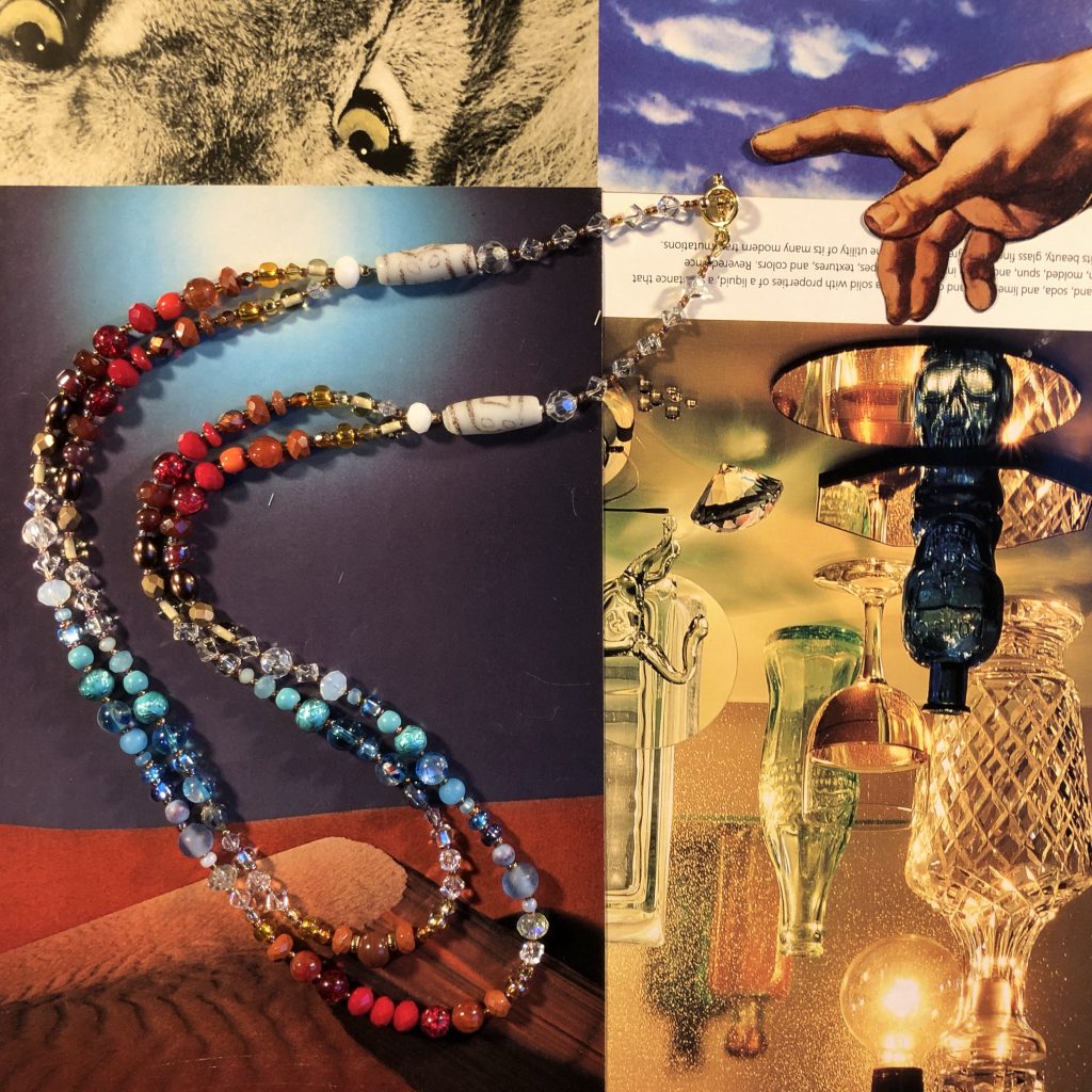 A primary colored, double-stranded necklace strung 34” long and thoughtfully repurposed from an assortment of glass, stone and crystal bead to create a one of a kind piece.